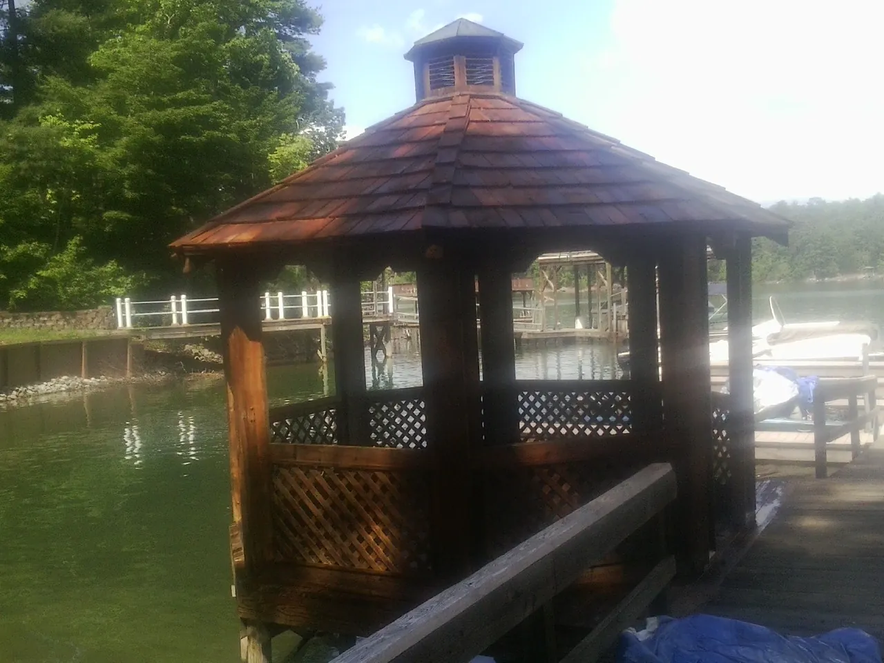 Cedar shake gazebo roof rebuilt on a lake dock in San Marcos